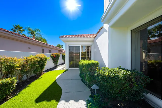 a view of a patio with couches and a fire pit