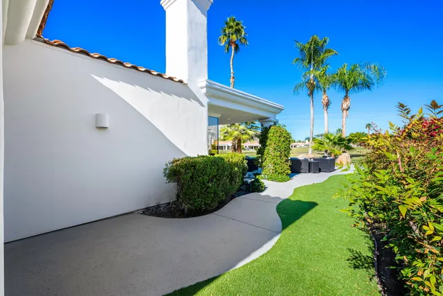 a view of a swimming pool and lounge chair