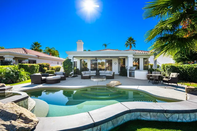 a spacious bathroom with a shower sink and mirror