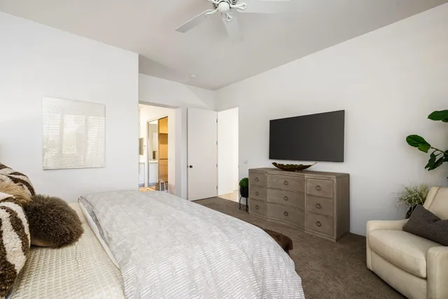 a bed room with a bed and a couch