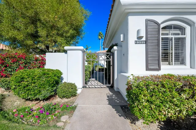 a view of a pathway in front of house