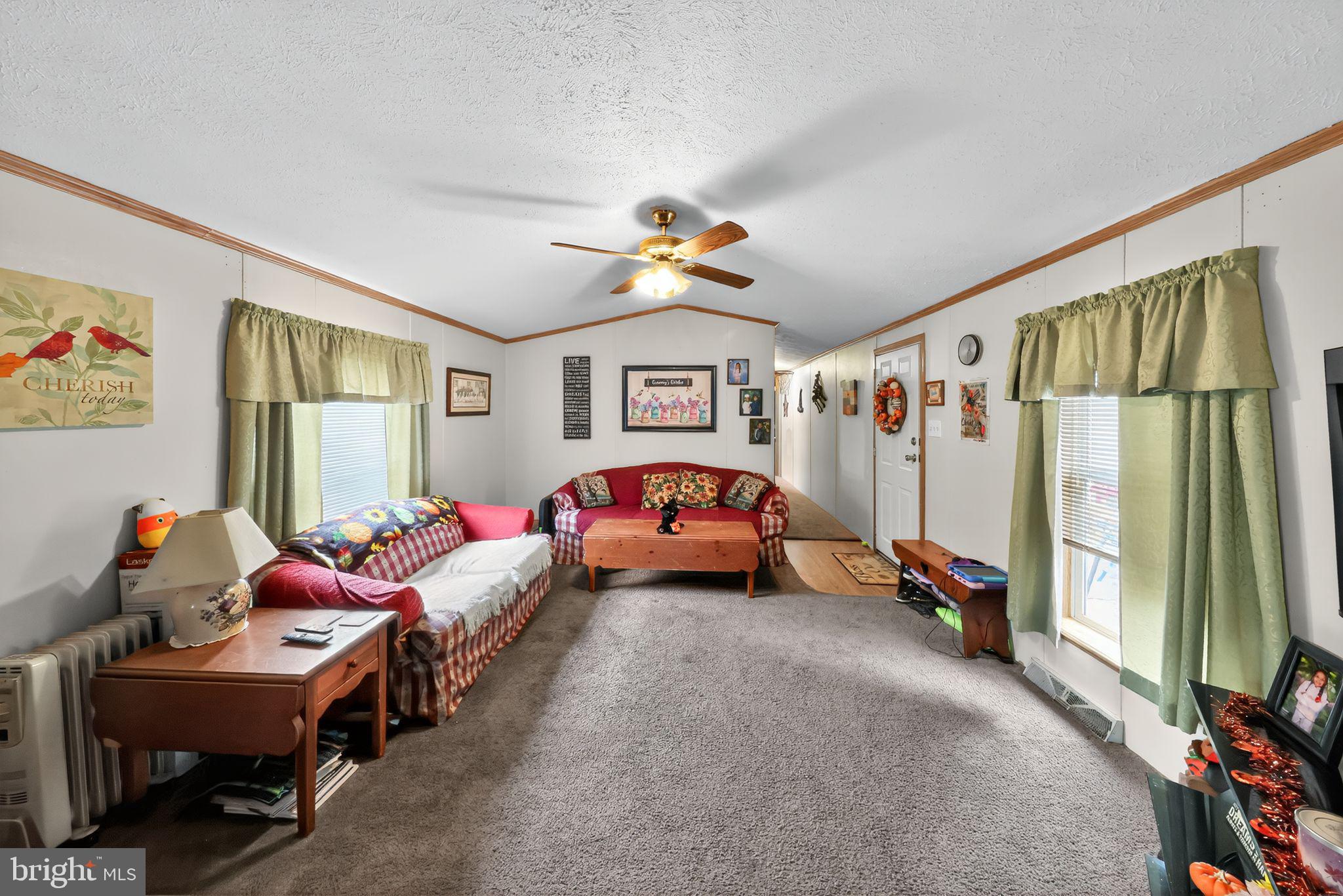 8 Penney Lane Coatesville, PA 19320 - Photo 3 of 14 a living room with furniture and a chandelier