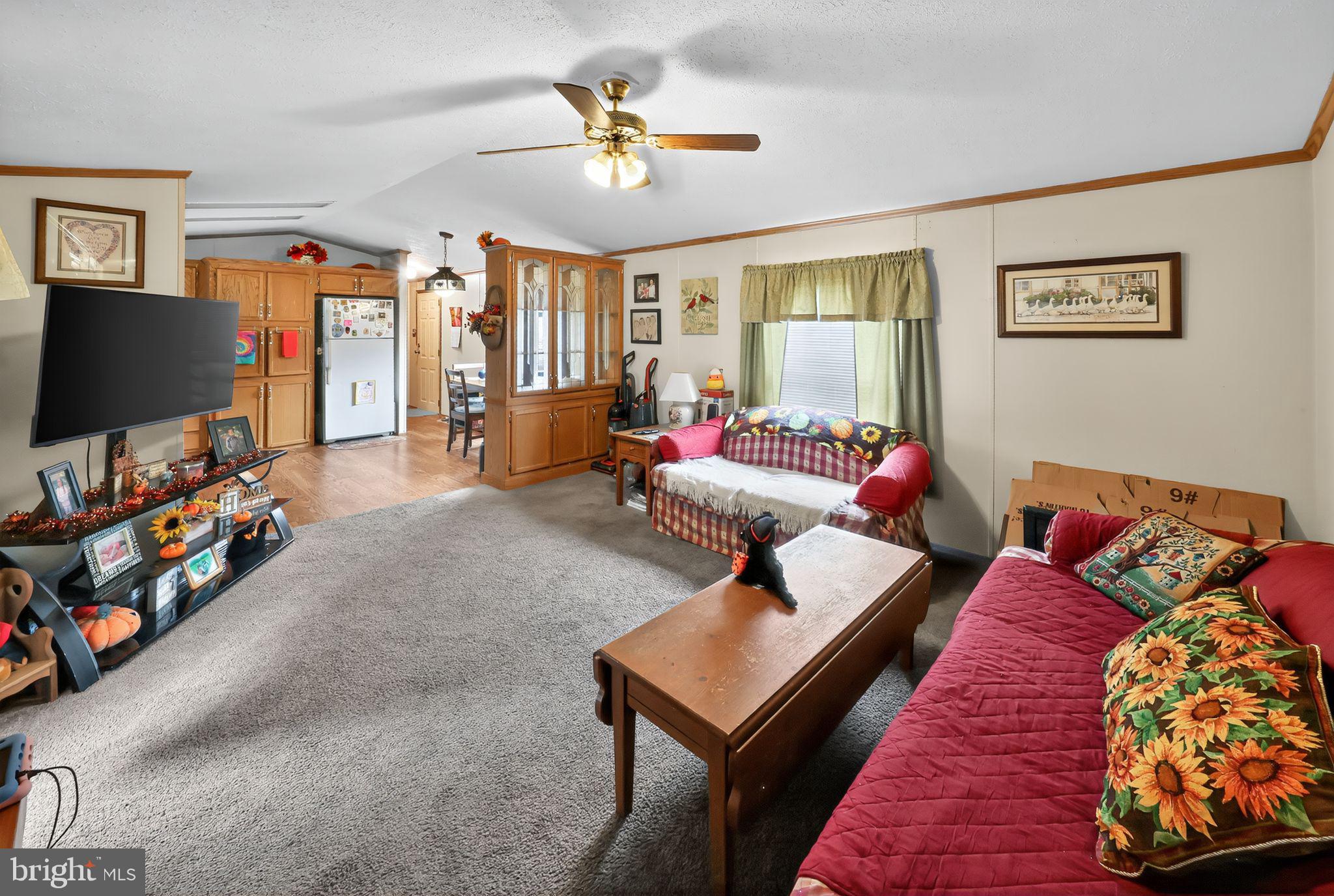 8 Penney Lane Coatesville, PA 19320 - Photo 4 of 14 a living room with furniture and a flat screen tv