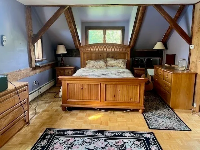 a living room with a table and chairs