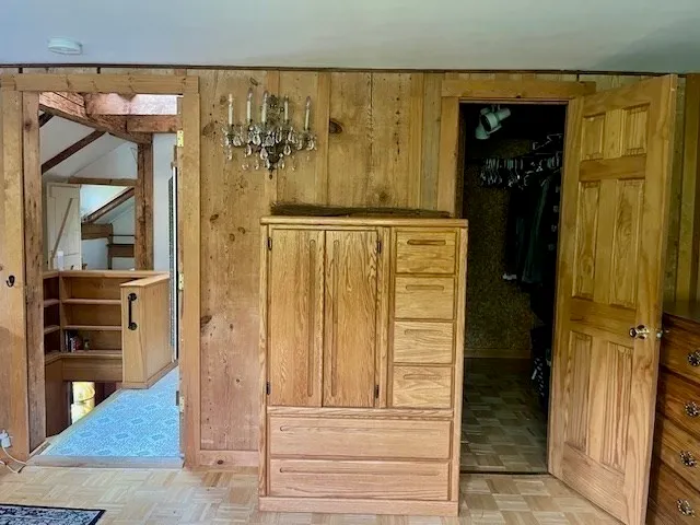 a view of room with window and refrigerator