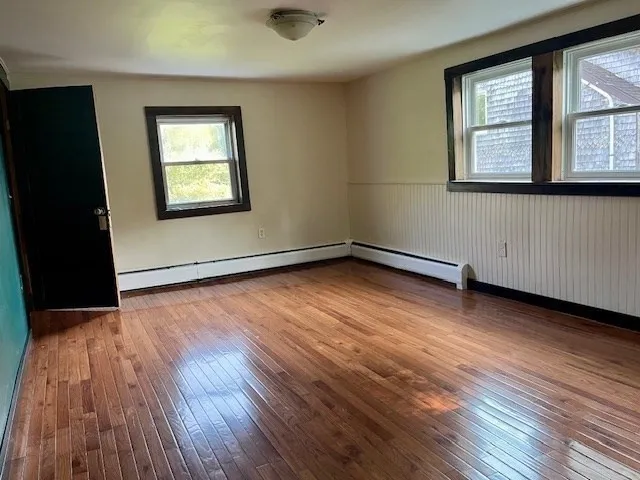 a bathroom with a bathtub and a window