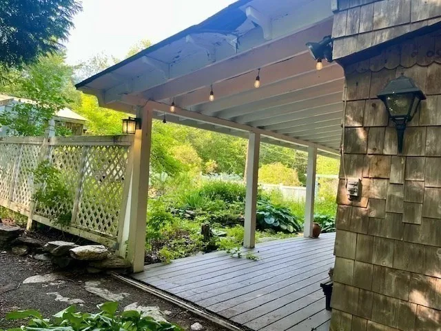 a house view with a garden space