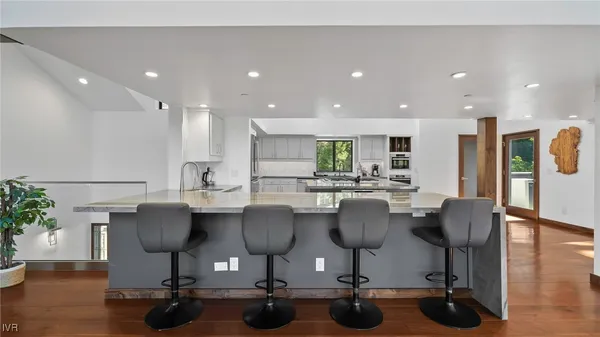 a view of kitchen with dining table and chairs