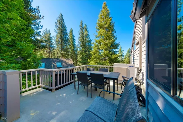 a view of a patio with iron fence