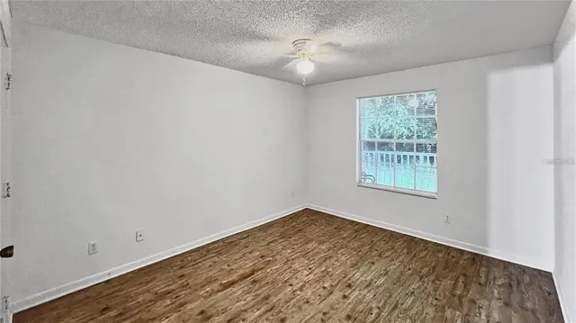 an empty room with a empty space and a window