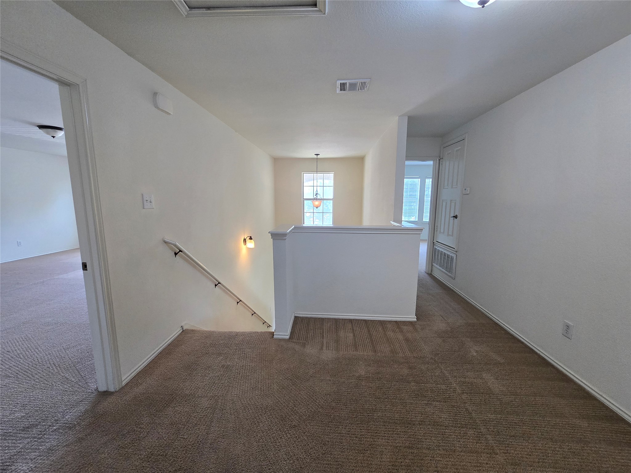2021 Rim Rock Drive Leander, TX 78641 - Photo 8 of 14 A well-lit upper landing offers adaptable living space.