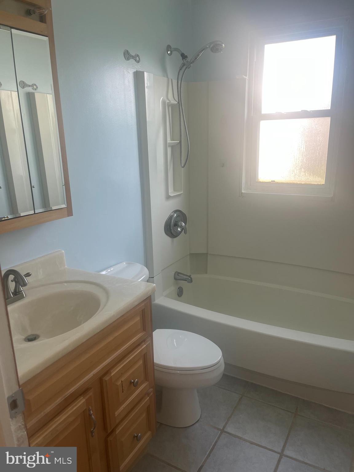 908 Homberg Avenue Baltimore, MD 21221 - Photo 14 of 31 a bathroom with a sink a toilet and a bathtub