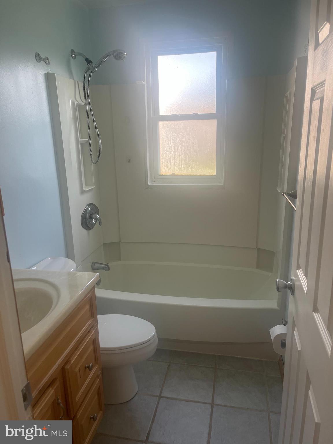 908 Homberg Avenue Baltimore, MD 21221 - Photo 15 of 31 a bathroom with a sink a toilet and a bathtub
