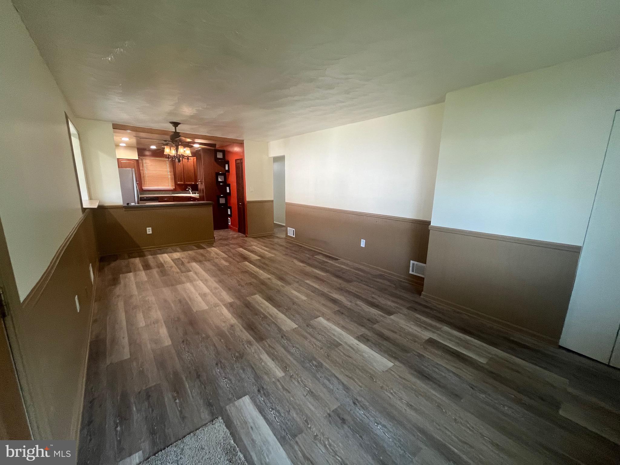908 Homberg Avenue Baltimore, MD 21221 - Photo 17 of 31 a view of a room with wooden floor