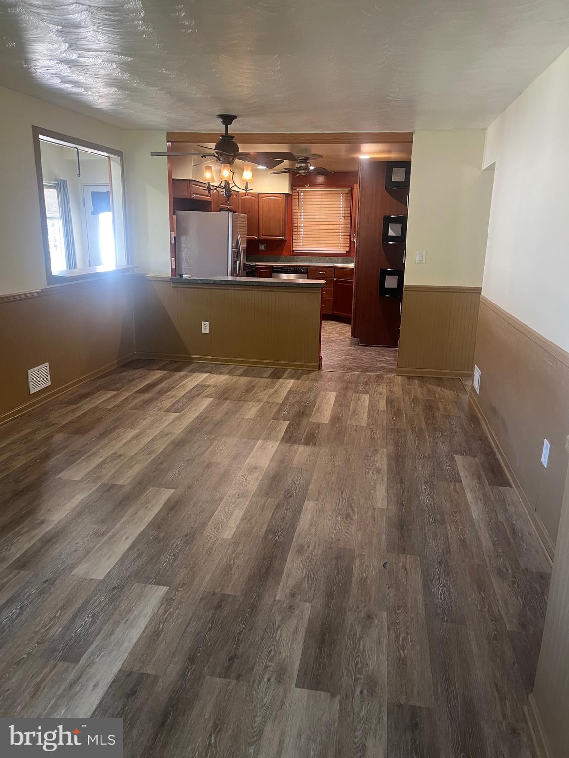 908 Homberg Avenue Baltimore, MD 21221 - Photo 18 of 31 en empty room with window and fireplace