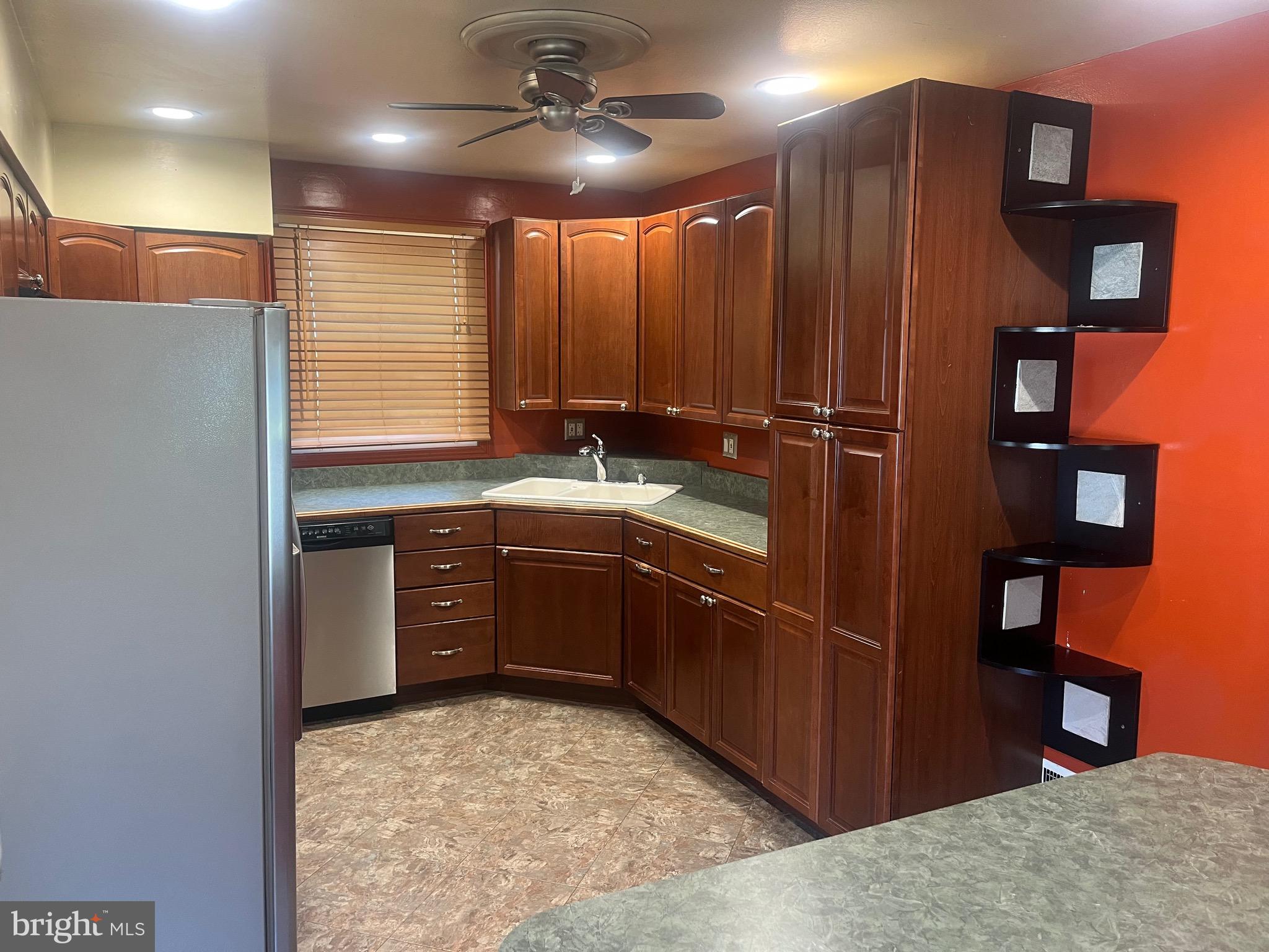 908 Homberg Avenue Baltimore, MD 21221 - Photo 21 of 31 a kitchen with stainless steel appliances granite countertop a refrigerator and a sink
