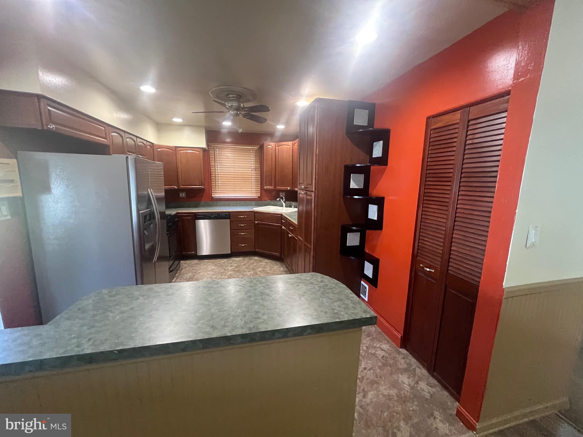 908 Homberg Avenue Baltimore, MD 21221 - Photo 25 of 31 a view of a refrigerator in kitchen and a window
