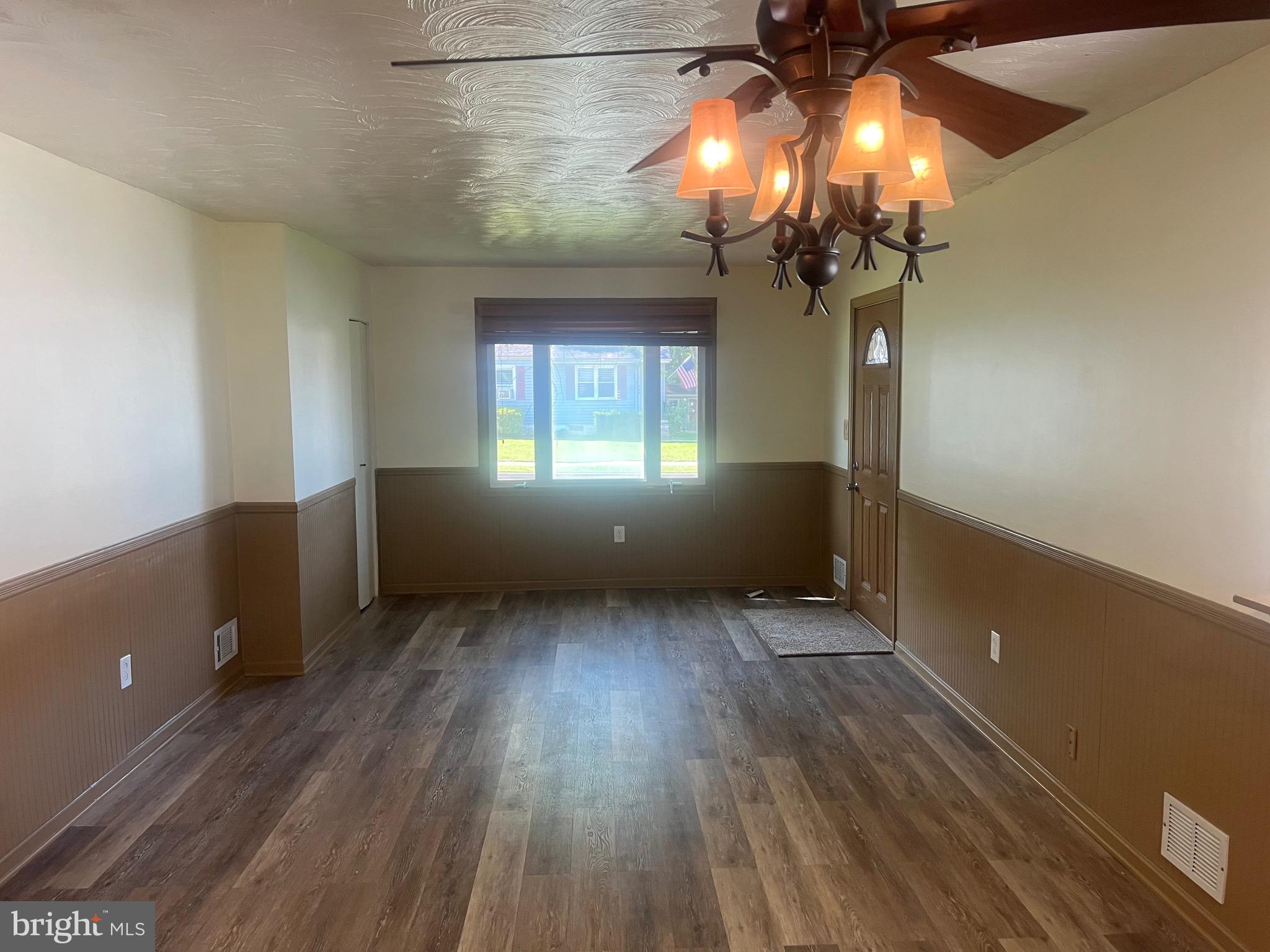 908 Homberg Avenue Baltimore, MD 21221 - Photo 27 of 31 wooden floor in an empty room with a window