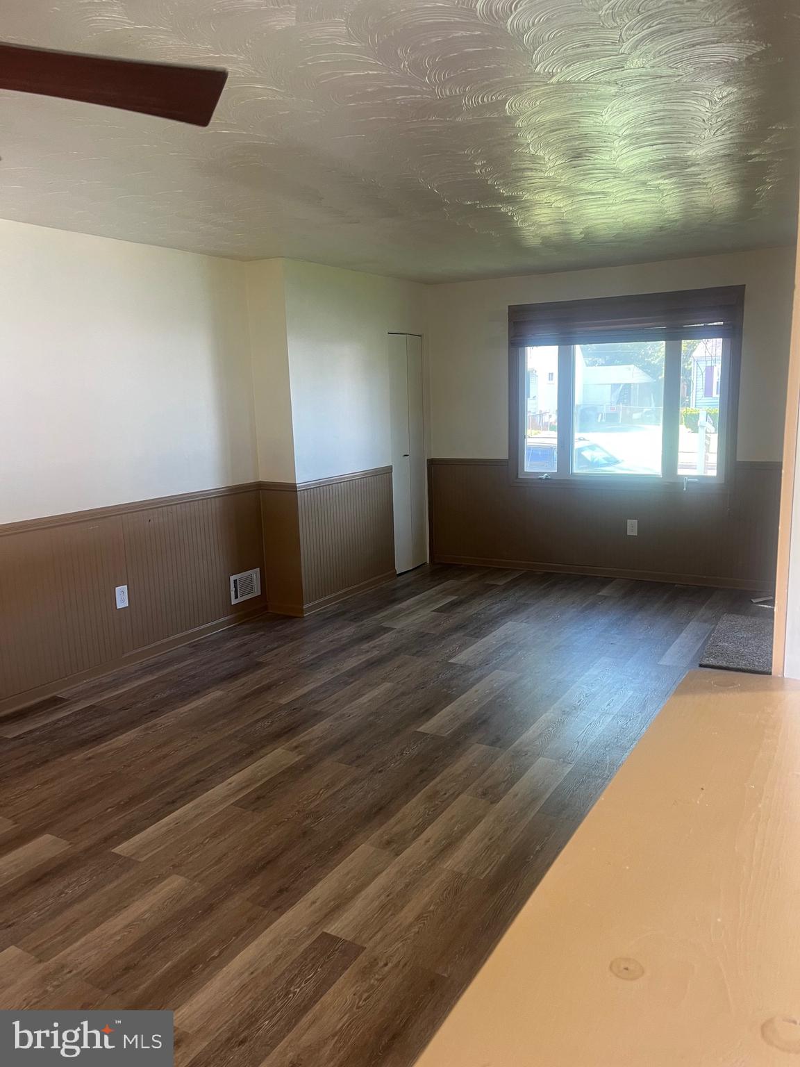 908 Homberg Avenue Baltimore, MD 21221 - Photo 28 of 31 a view of empty room with wooden floor and fan