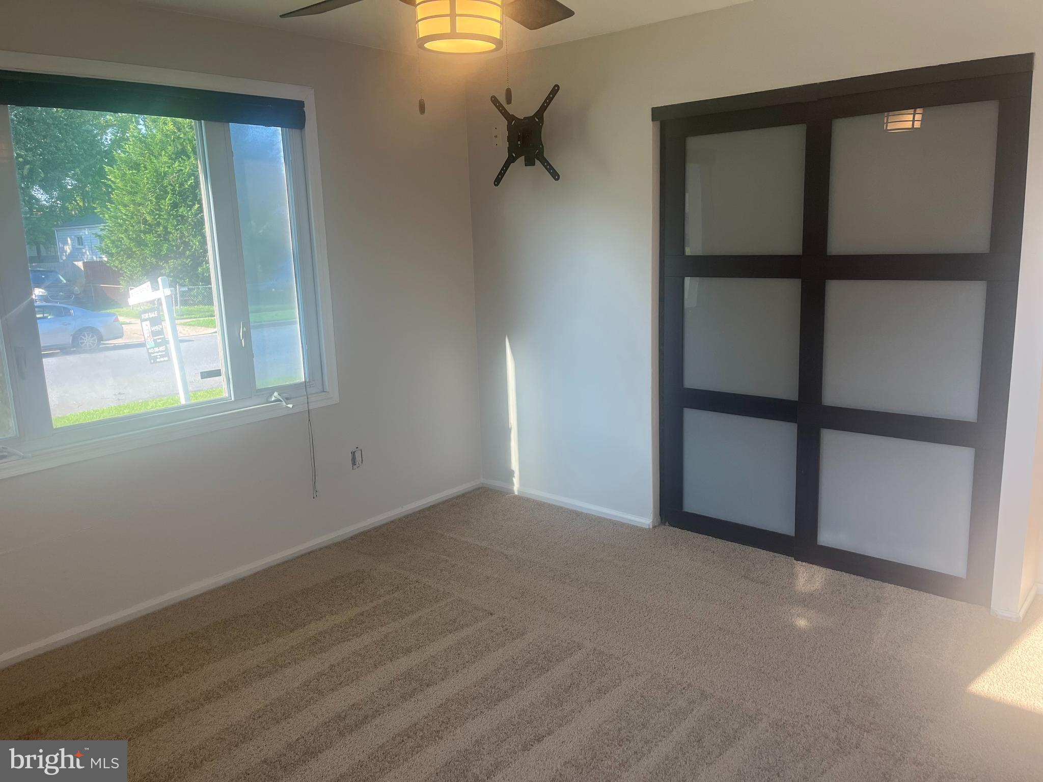 908 Homberg Avenue Baltimore, MD 21221 - Photo 8 of 31 a view of an empty room with a window