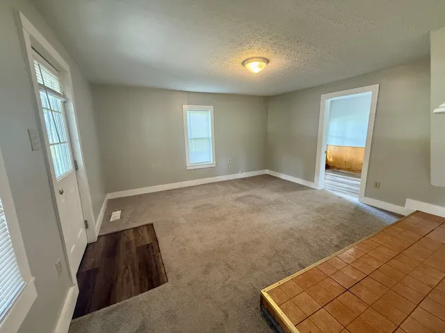 a view of an empty room and window