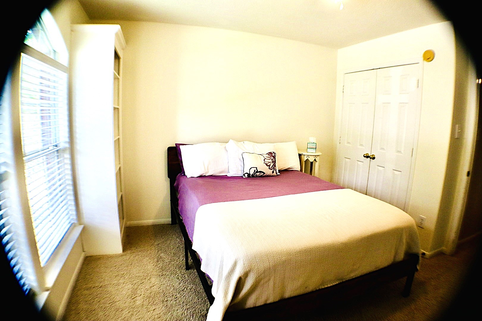 19114 Emory Trail Spring, TX 77388 - Photo 24 of 32 Cozy bedroom with soft lighting, featuring enough room for a comfortable bed. There's a window with blinds for natural light and a built-in shelving unit for storage. The room has a carpeted floor and a closet with double doors.