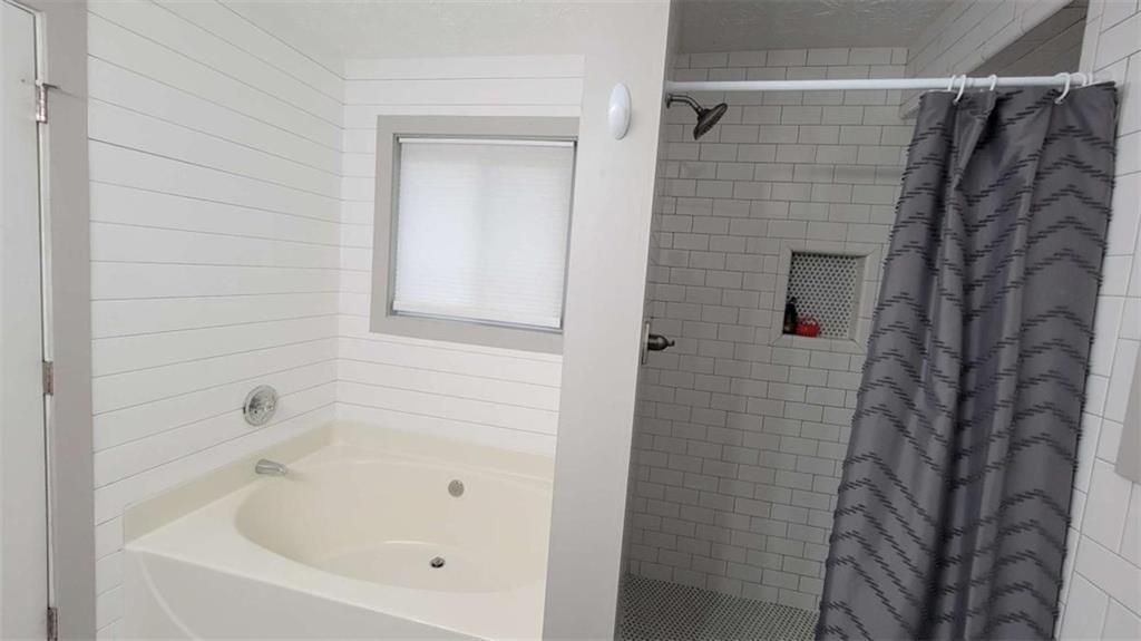 2140 Summerset Drive Monroe, GA 30656 - Photo 18 of 43 a bathroom with a bathtub and shower