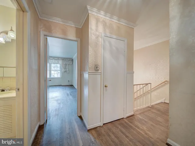 wooden floor with white walls