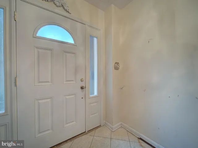 a view of a closet area with mirror