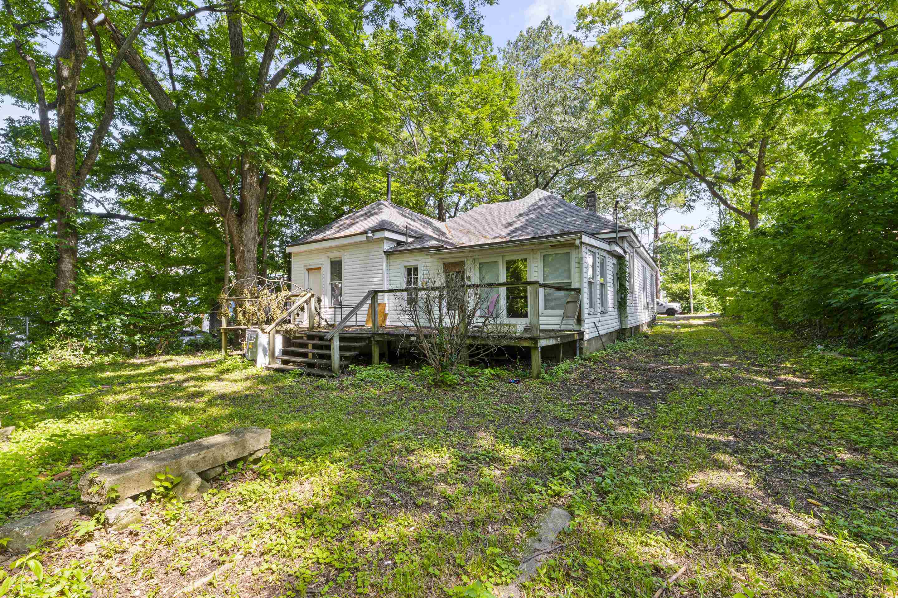 3459 Spottswood Avenue Memphis, TN 38111 - Photo 2 of 9 a white house that has a tree in front of it