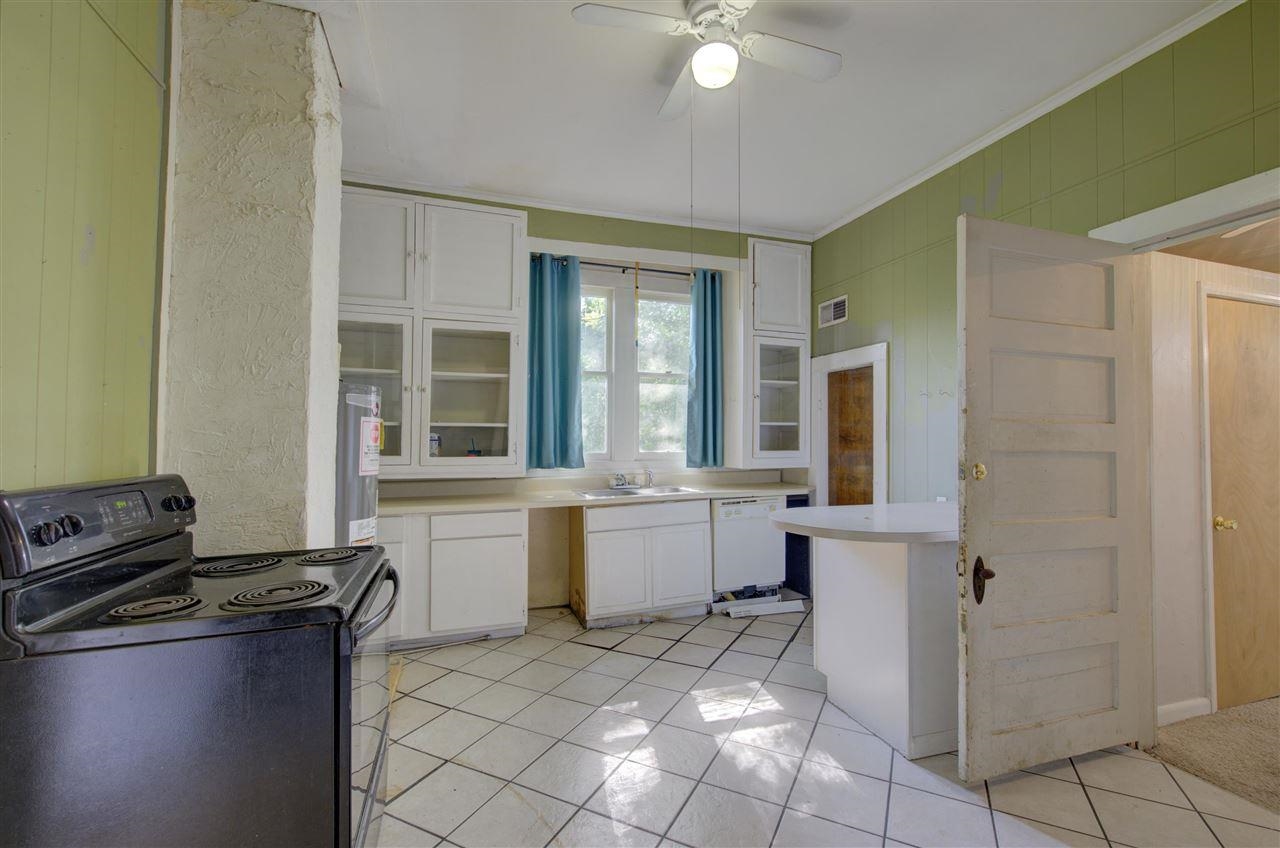 3459 Spottswood Avenue Memphis, TN 38111 - Photo 3 of 9 a large white kitchen with sink and a refrigerator