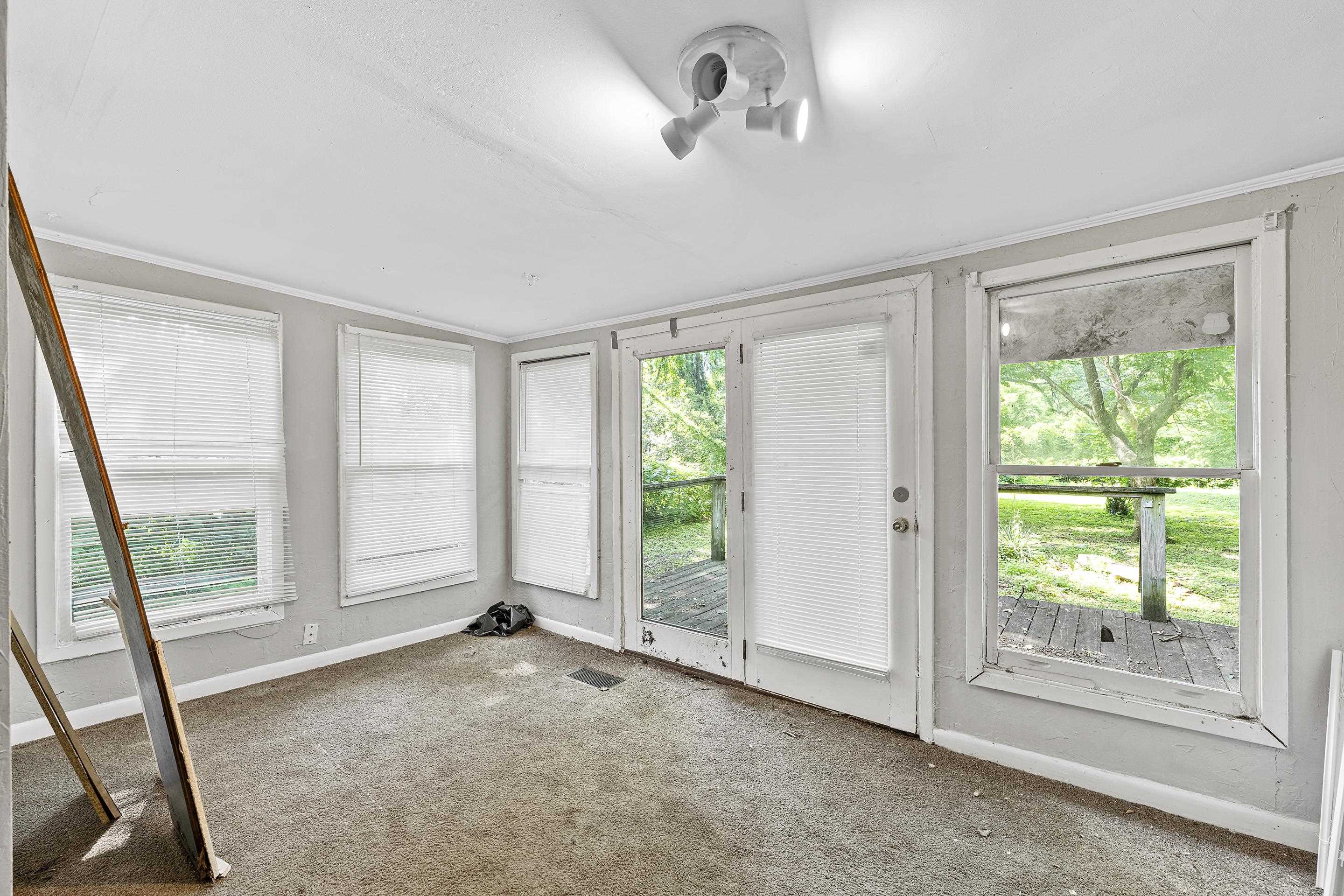 3459 Spottswood Avenue Memphis, TN 38111 - Photo 4 of 9 a view of an empty room with a window