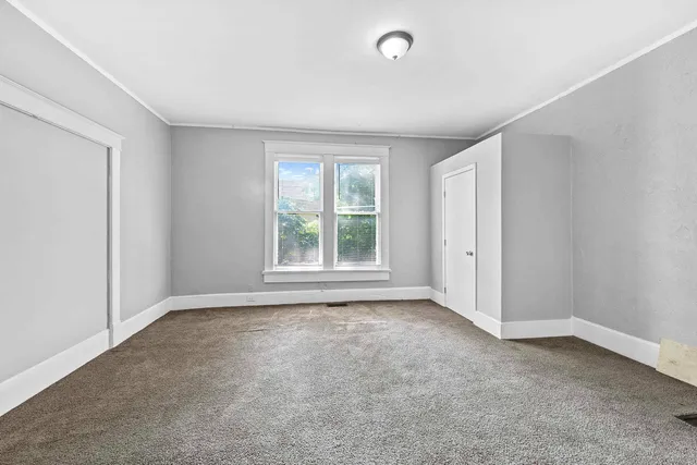 an empty room with windows