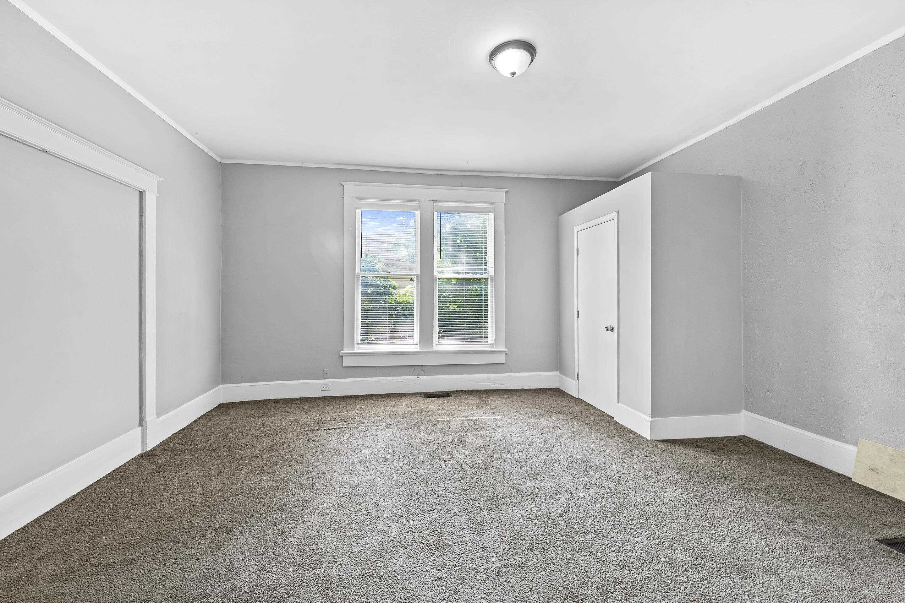 3459 Spottswood Avenue Memphis, TN 38111 - Photo 5 of 9 an empty room with windows