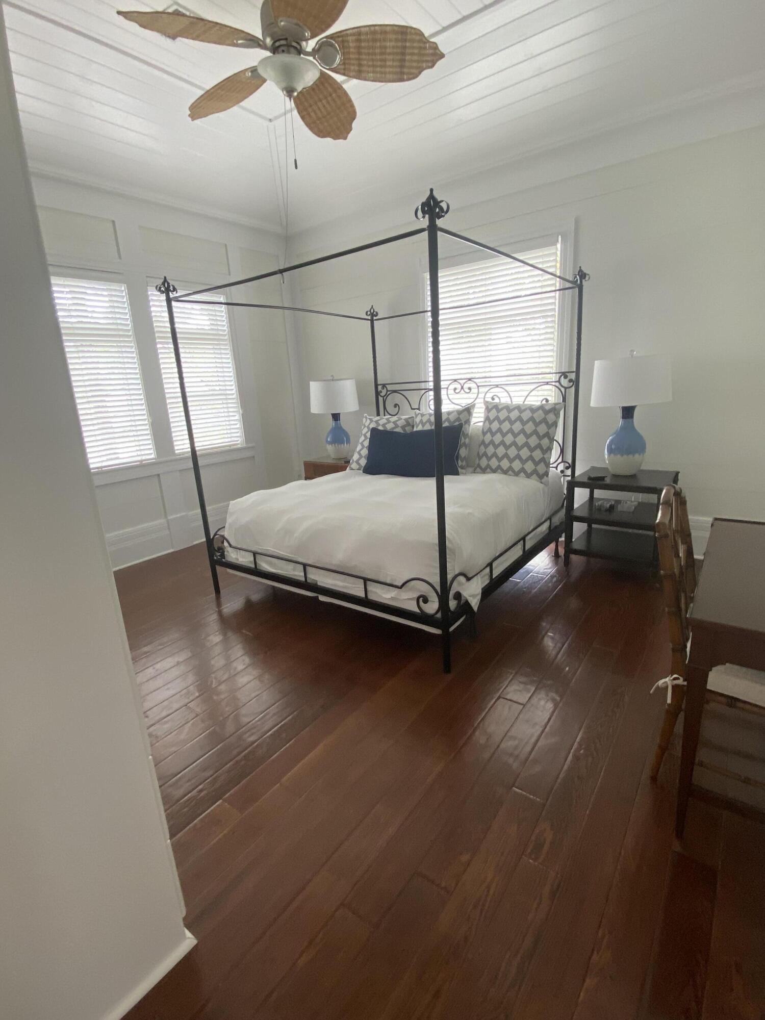 8119 Inspiration Drive, Unit B2 Miramar Beach, FL 32550 - Photo 18 of 44 a bed sitting in a room next to a window