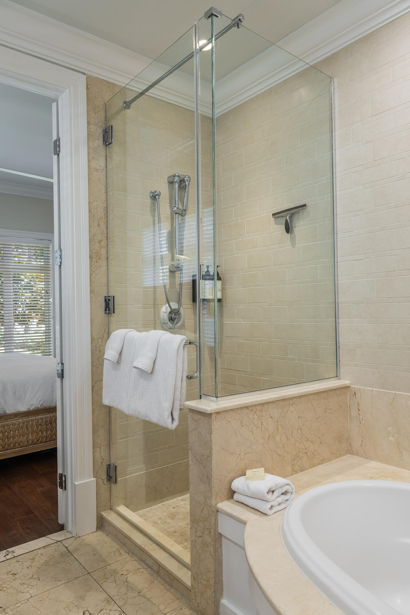 8119 Inspiration Drive, Unit B2 Miramar Beach, FL 32550 - Photo 22 of 44 a bathroom with a bathtub and a shower