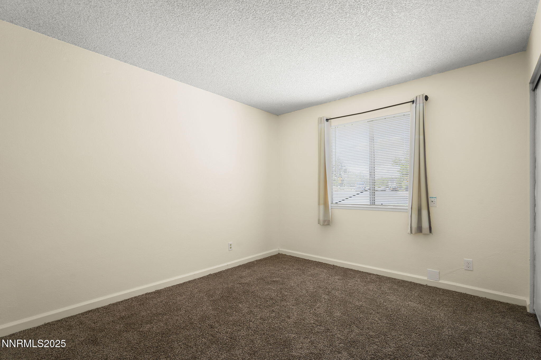 2450 Lymbery Street, Unit 105 Reno, NV 89509 - Photo 11 of 21 an empty room with a window