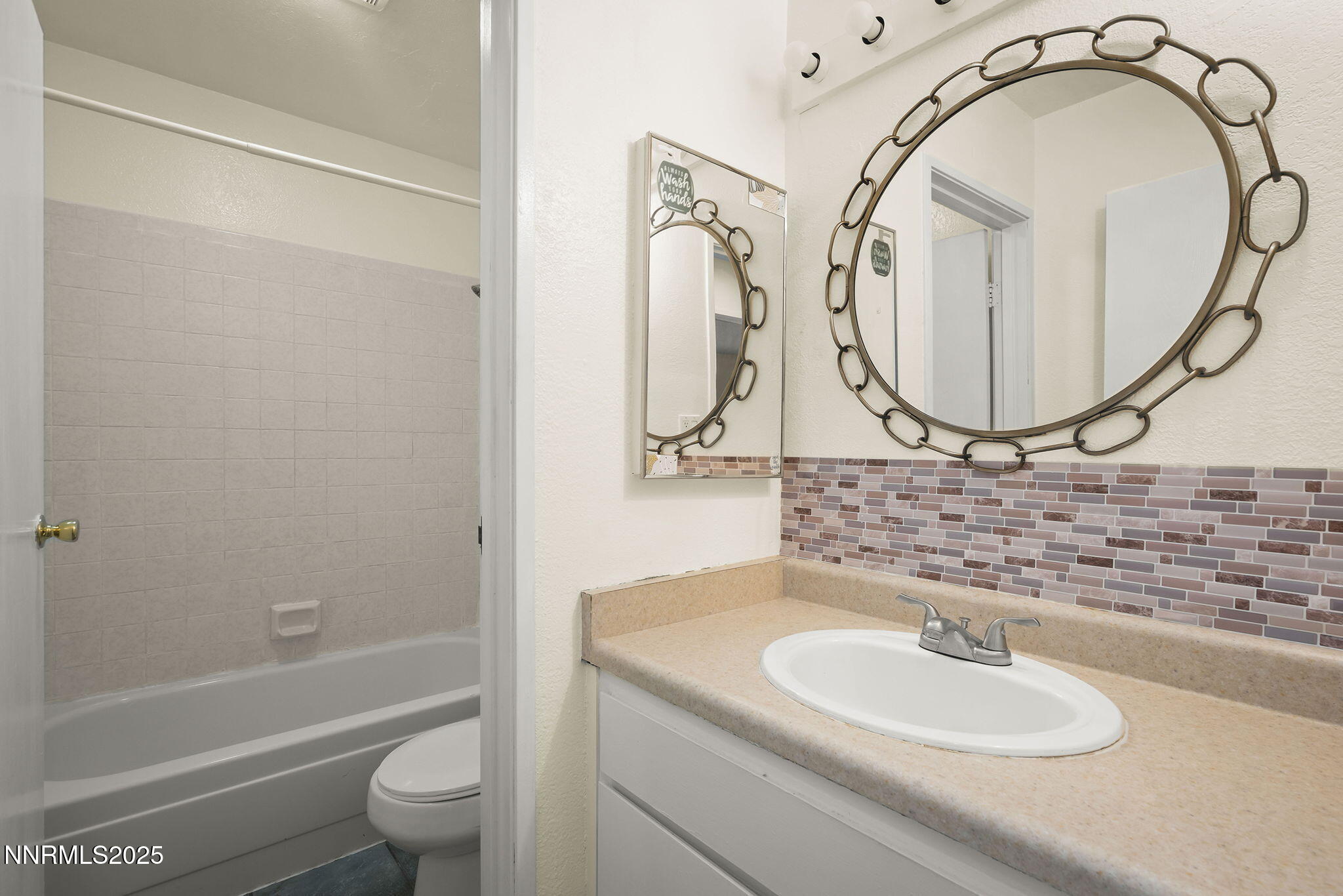2450 Lymbery Street, Unit 105 Reno, NV 89509 - Photo 12 of 21 a bathroom with a sink and a mirror