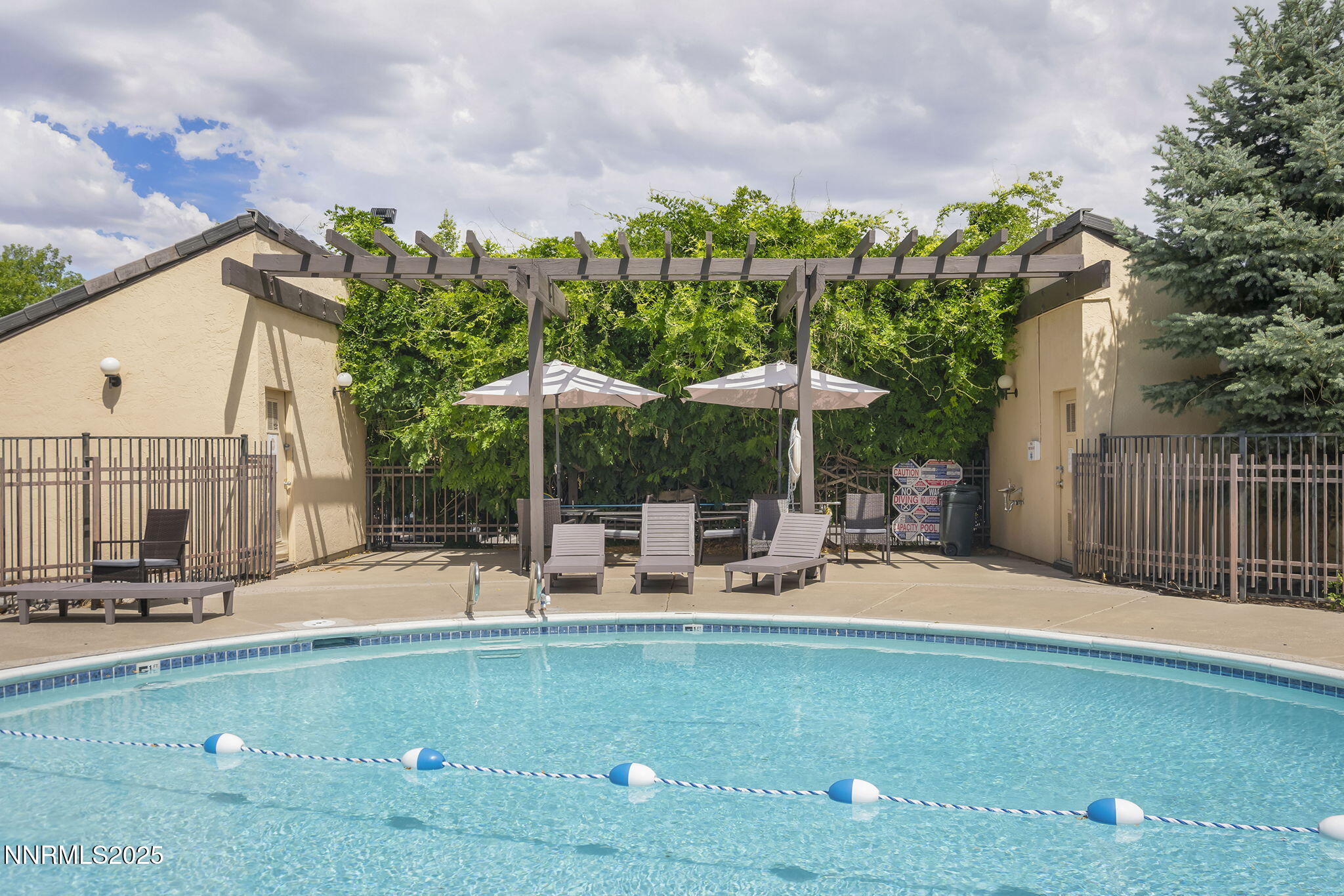 2450 Lymbery Street, Unit 105 Reno, NV 89509 - Photo 18 of 21 a view of a swimming pool with a patio