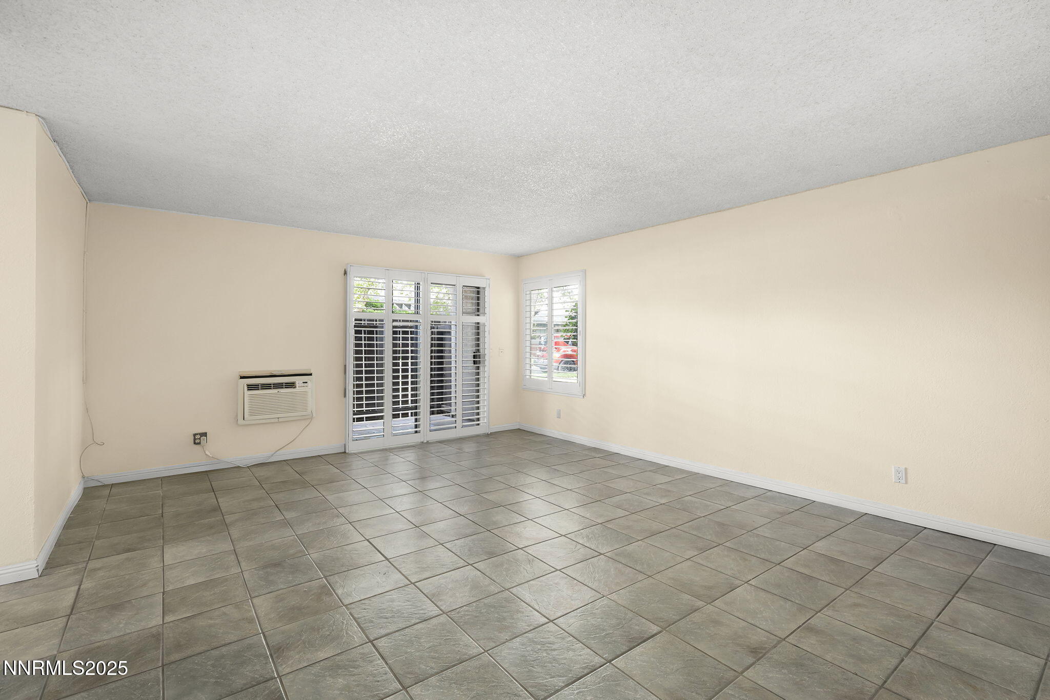 2450 Lymbery Street, Unit 105 Reno, NV 89509 - Photo 5 of 21 a view of an empty room with a window