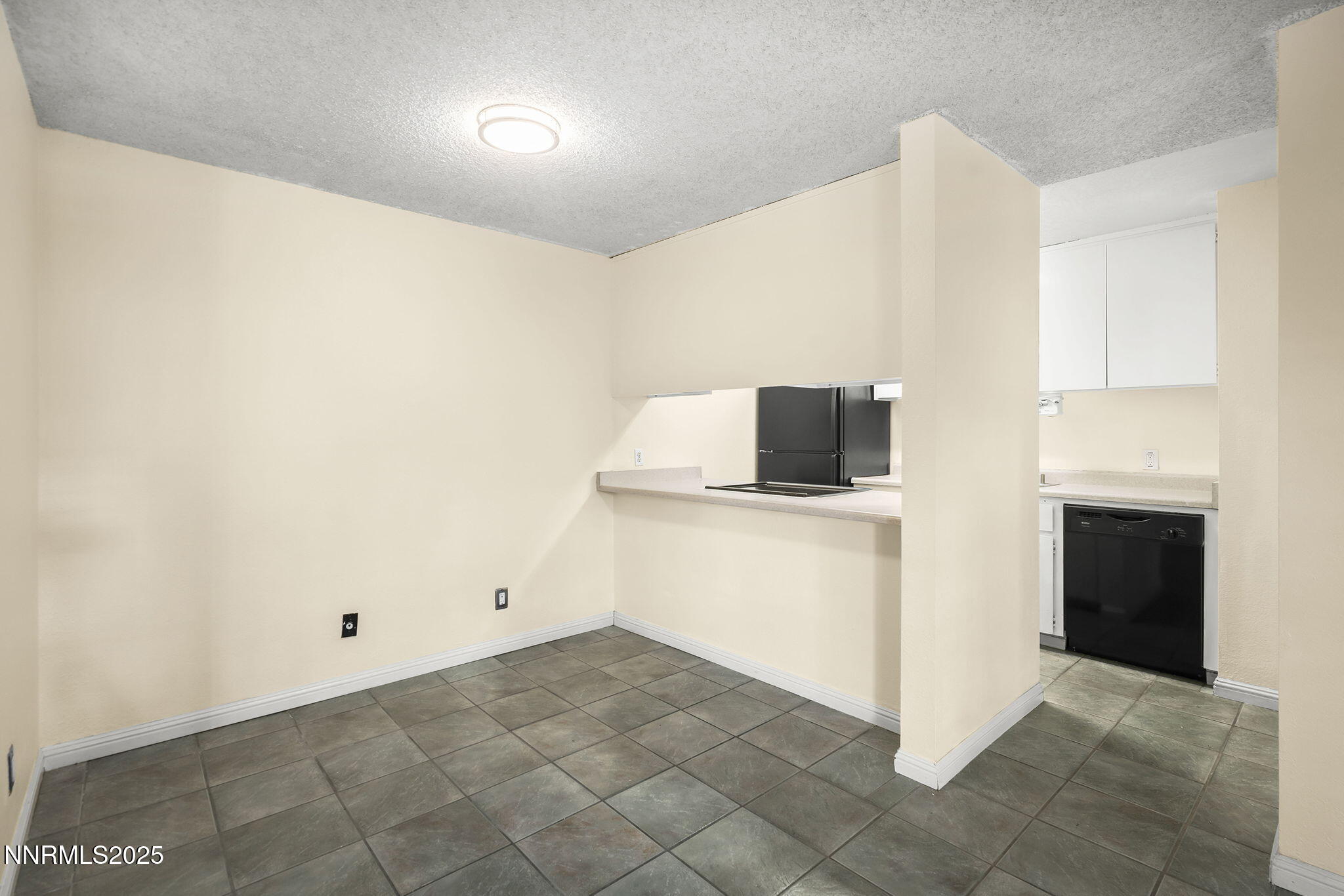 2450 Lymbery Street, Unit 105 Reno, NV 89509 - Photo 6 of 21 a view of a livingroom with an empty space and a fireplace