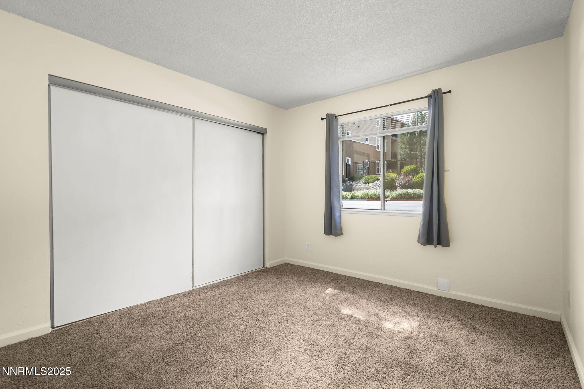 2450 Lymbery Street, Unit 105 Reno, NV 89509 - Photo 10 of 21 an empty room with windows