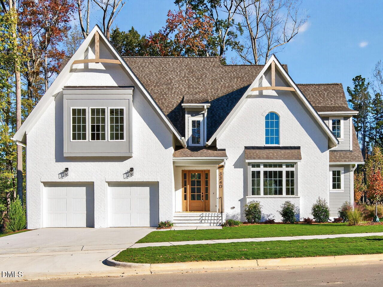 a view of a house with a yard and plants