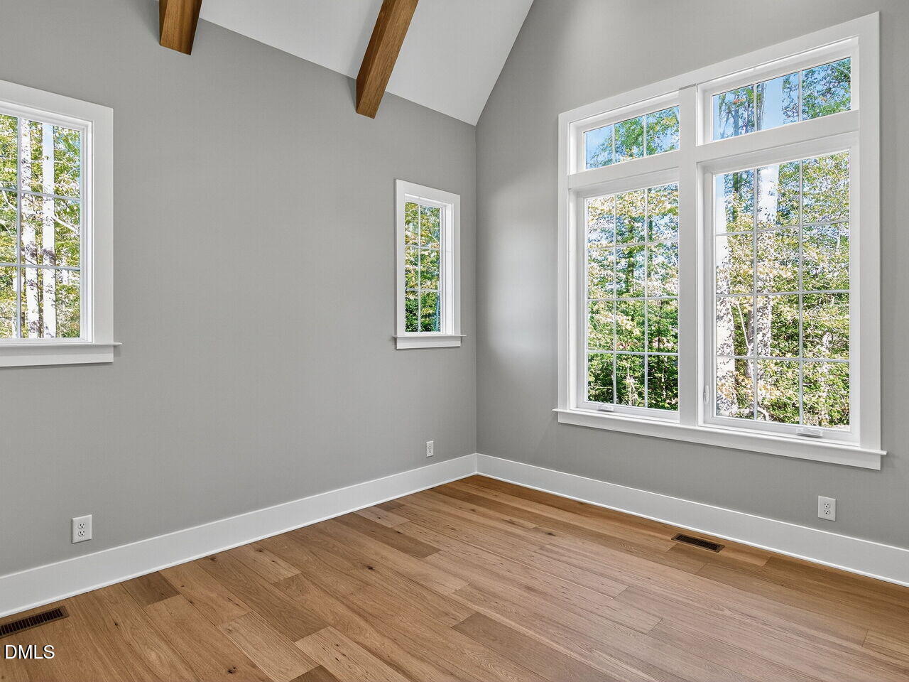 3340 Colby Chase Drive Apex, NC 27539 - Photo 25 of 59 an empty room with wooden floor and windows