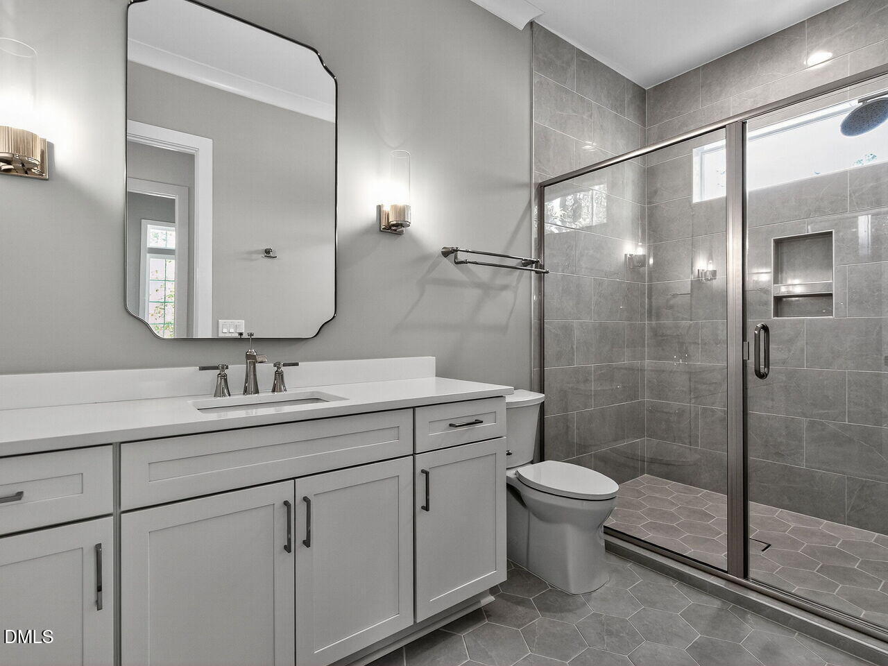 3340 Colby Chase Drive Apex, NC 27539 - Photo 27 of 59 a bathroom with a double vanity sink toilet and shower