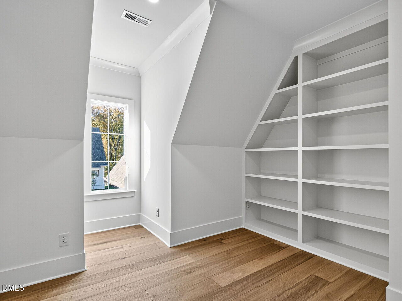 3340 Colby Chase Drive Apex, NC 27539 - Photo 33 of 59 a view of an empty room with wooden floor and a window