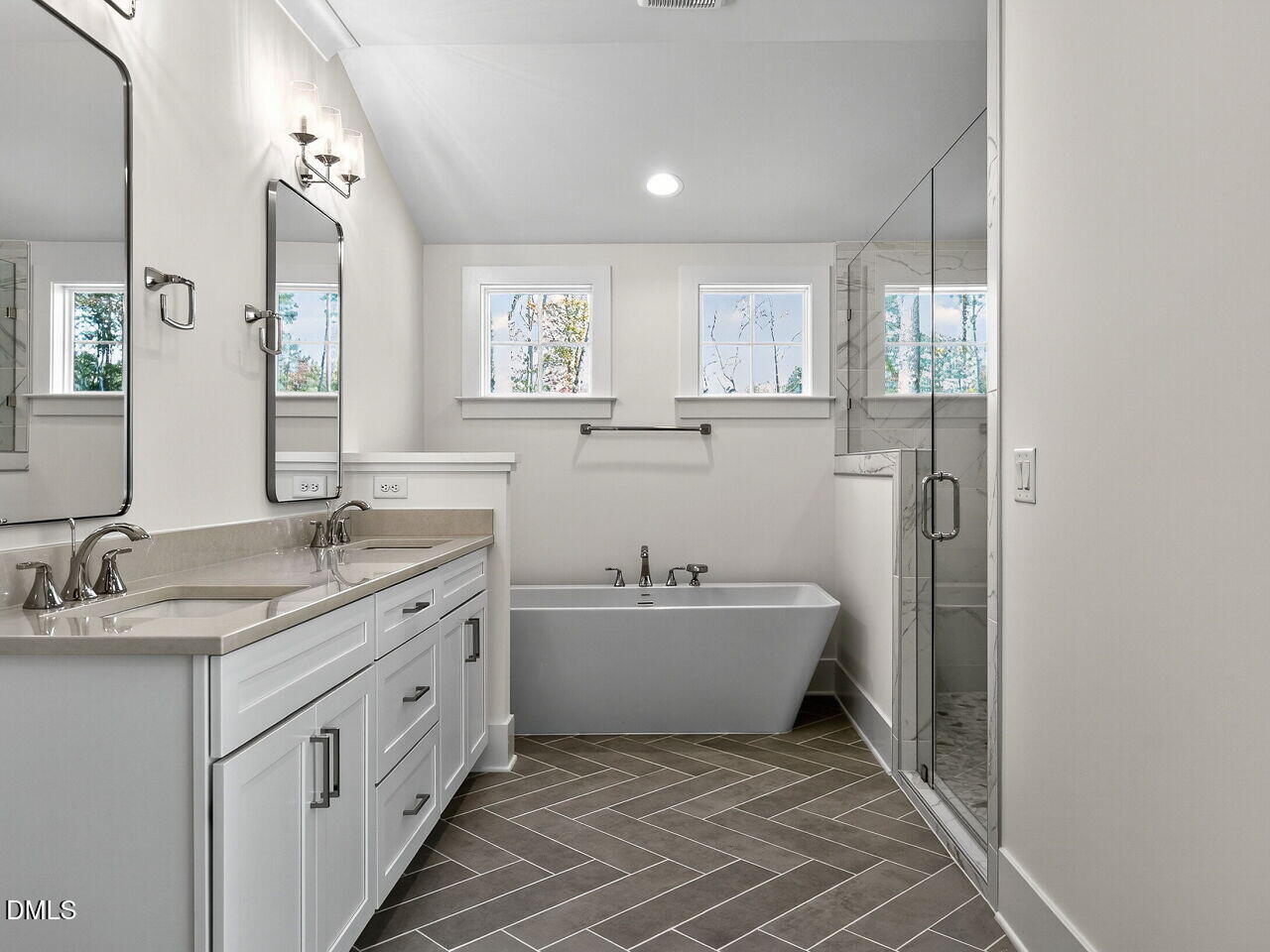 3340 Colby Chase Drive Apex, NC 27539 - Photo 38 of 59 a spacious bathroom with a double vanity sink mirror and a bathtub