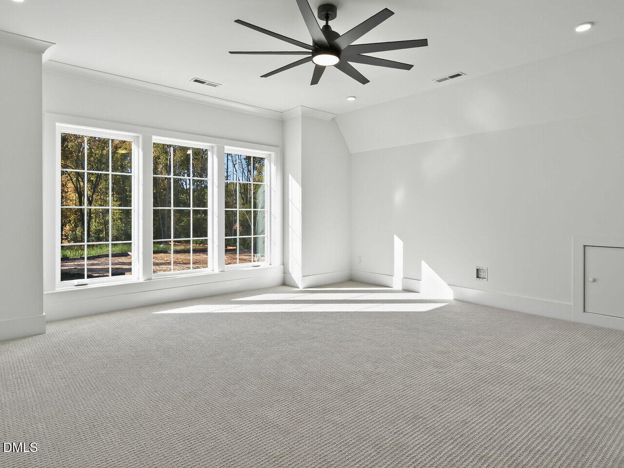3340 Colby Chase Drive Apex, NC 27539 - Photo 47 of 59 a view of a livingroom with a ceiling fan and window