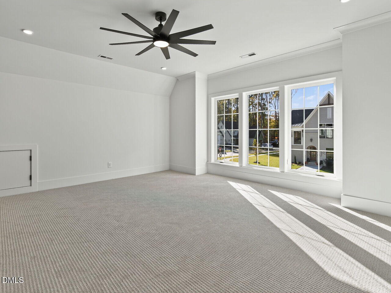 3340 Colby Chase Drive Apex, NC 27539 - Photo 48 of 59 a view of an empty room with a window and a ceiling fan