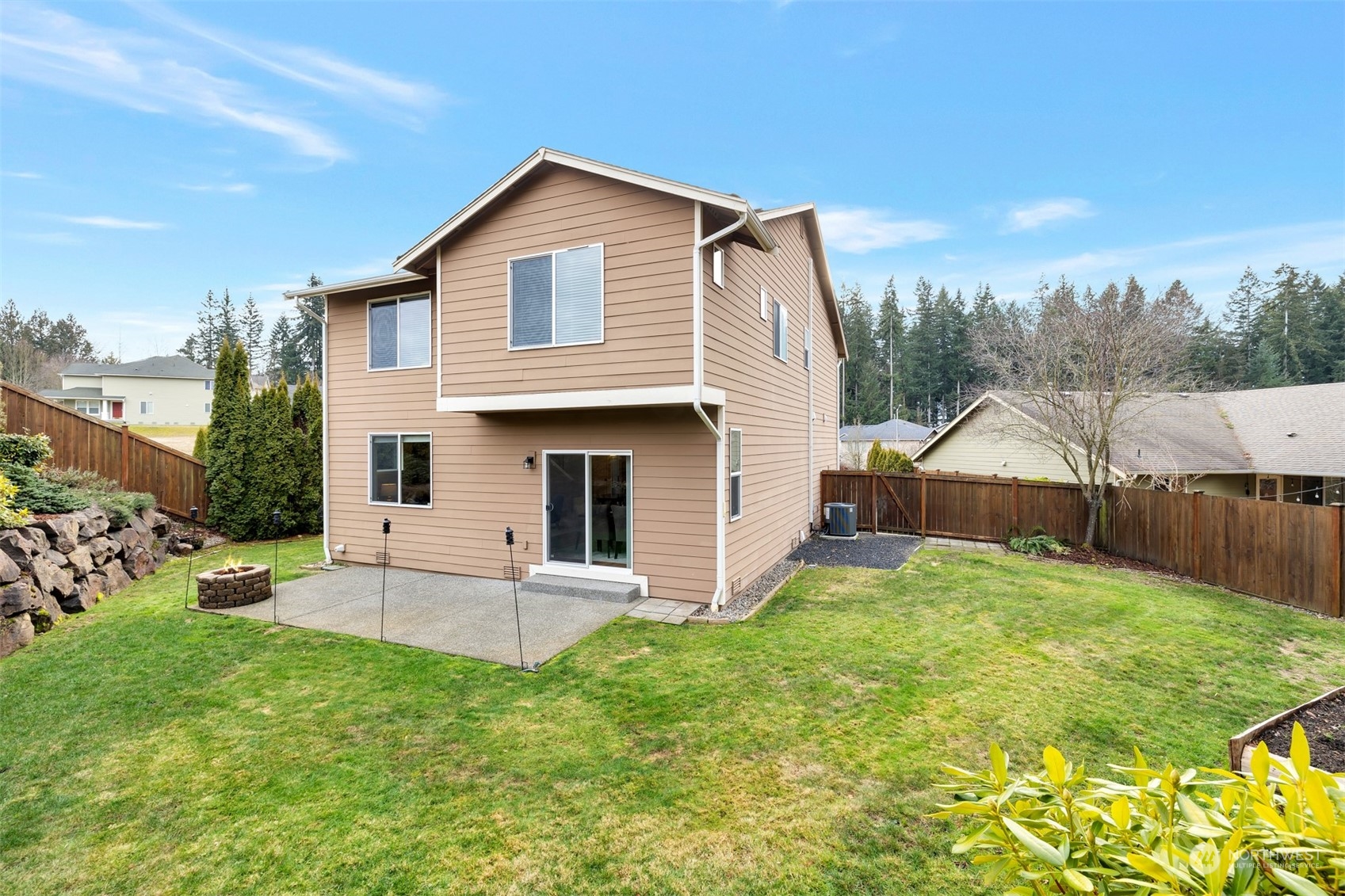 19867 Mountain Ridge Road Southeast Monroe, WA 98272 - Photo 35 of 40 a view of a house with a yard and sitting area